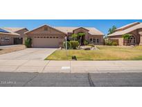Charming single-story home with well-manicured lawn and inviting curb appeal at 251 E Arabian Dr, Gilbert, AZ 85296