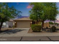 Inviting single-Gathering home featuring a two-car garage, desert landscaping, and a neutral color scheme at 5320 E Silverbell Rd, San Tan Valley, AZ 85143