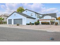 A charming two-story home with a well-manicured yard and a two-car garage at 5742 W Shannon St, Chandler, AZ 85226