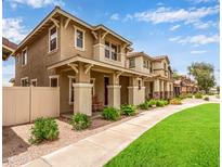 Inviting two-story home showcasing a well-manicured lawn and charming front porch in a sidewalk neighborhood at 5840 E Holmes Ave, Mesa, AZ 85206