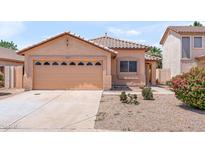 Charming single-story home with a well-manicured lawn and a two-car garage in a friendly neighborhood at 684 E Redondo Dr, Gilbert, AZ 85296