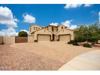 Spacious two-story home featuring a paved circular driveway and a three-car garage at 7432 W Bronco Trl, Peoria, AZ 85383