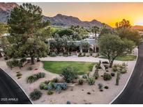 Stunning property boasts lush landscaping and mountain views, creating a serene and picturesque setting at 8022 N Ironwood Dr, Paradise Valley, AZ 85253