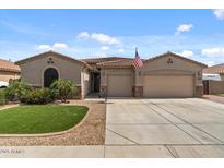 Charming single-story home with a well-manicured lawn and a spacious two-car garage, perfect for comfortable living at 10033 W Jessie Ln, Peoria, AZ 85383