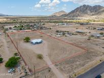 Spacious desert property with a house, clearly marked boundaries, and mountain views at 11192 N Johnson Rd, Maricopa, AZ 85139