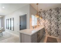 Open concept kitchen offers ample counter space, modern fixtures, and natural light at 11333 N 92Nd St # 1075, Scottsdale, AZ 85260