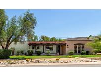 Charming single-story home with a classic red tile roof and a beautifully landscaped front yard at 12835 N 16Th Dr, Phoenix, AZ 85029