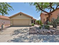 Charming single-story home featuring a two-car garage and meticulously landscaped front yard at 17421 N 14Th St, Phoenix, AZ 85022