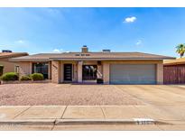 Charming single-story home with a well-maintained front yard and a two-car garage at 1802 W Isleta Ave, Mesa, AZ 85202