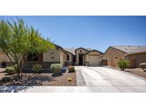 Charming single story home featuring desert landscaping and a spacious driveway in a desirable neighborhood at 18493 W Hiddenview Dr, Goodyear, AZ 85338