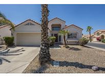 Charming single-Gathering home with desert landscaping, two car garage and decorative architectural features at 823 W Bradford Dr, Gilbert, AZ 85233