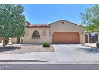 Charming single-story home with a red tile roof, neutral stucco, and a spacious two-car garage at 36255 W Marin Ave, Maricopa, AZ 85138