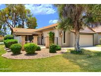 Charming single-story home featuring a well-maintained yard and a private front patio at 365 Leisure World --, Mesa, AZ 85206
