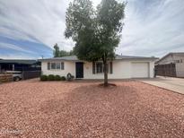 Charming single-story home with well-maintained landscaping and a two-car garage at 4602 N 50Th Ave, Phoenix, AZ 85031