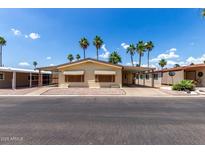 Charming single-story home featuring a covered carport and desert landscaping at 9302 E Broadway Rd # 45, Mesa, AZ 85208