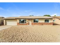 Charming single-story home with desert landscaping and a two-car garage at 2922 S Cottonwood Dr, Tempe, AZ 85282