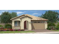 Charming single-story home featuring a tile roof, arched entryway, two-car garage and low maintenance desert landscaping at 35017 N Sacramento Wash Rd, San Tan Valley, AZ 85144