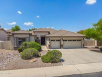 Charming single-story home with desert landscaping, three-car garage, and neutral color palette at 4121 E Patrick St, Gilbert, AZ 85295