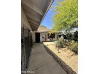 Charming front yard of this well-maintained home with mature landscaping and a cozy seating area at 14402 N Saguaro Blvd # A, Fountain Hills, AZ 85268