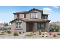 Charming two-story home with stone accents, neutral colors, and a well-maintained front yard at 14657 W Sand Hills Rd, Surprise, AZ 85387