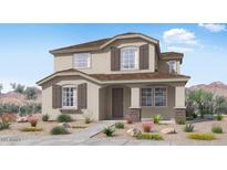 Charming two-story home with neutral paint, brown shutters, and low-maintenance landscaping at 14663 W Sand Hills Rd, Surprise, AZ 85387