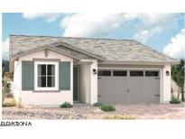 Charming single-story home with gray two car garage and light-colored stucco, complemented by decorative shutters at 17967 W Allen St, Goodyear, AZ 85338