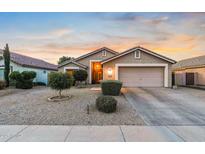 Charming single-story home featuring desert landscaping and an attached two-car garage at 300 W Cardinal Way, Chandler, AZ 85286