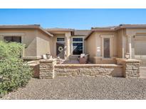 Inviting front entrance with stone accents, lovely front door, and cozy seating area at 6131 S Bradshaw Way, Chandler, AZ 85249