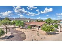 Charming single-story home with desert landscaping and mountain views at 833 N 110Th St, Mesa, AZ 85207