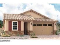 Charming one-story home featuring a two-car garage, stone accents, and a tile roof at 8713 S 170Th Ave, Goodyear, AZ 85338