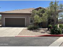 Charming single-story home with a well-maintained landscape and a two-car garage at 14000 N 94Th St # 1077, Scottsdale, AZ 85260