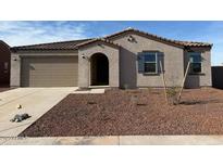 Single-level home featuring a low-maintenance front yard, a two-car garage, and an arched entryway at 1418 E Jacqueline Pl, Casa Grande, AZ 85122