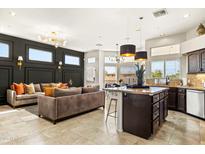A stylish open-concept living space with a modern kitchen and cozy seating area at 14826 N 92Nd Pl, Scottsdale, AZ 85260