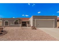 Charming single-story home with a well-maintained yard, two-car garage and a beautiful red tile roof at 1955 Leisure World --, Mesa, AZ 85206