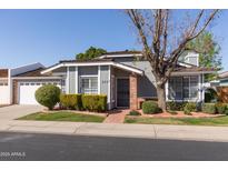 Charming single-story home with brick accents, manicured landscaping, and a welcoming front entrance, showing great curb appeal at 222 E Danbury Rd, Phoenix, AZ 85022