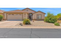 Charming single-story home with desert landscaping, two car garage, and a gated front entry at 4611 E Night Glow Dr, Cave Creek, AZ 85331
