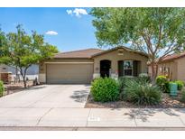 Charming single-story home with desert landscaping, a two-car garage, and a welcoming front porch at 907 E Kelsi Ave, San Tan Valley, AZ 85140
