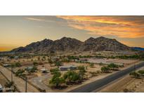 Expansive ranch property with horse facilities nestled against a scenic mountain backdrop at 11912 N Thunderbird Rd, Maricopa, AZ 85139