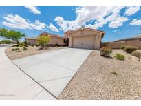 Charming single-story home with a well-maintained yard and spacious two-car garage at 15248 S 182Nd Ln, Goodyear, AZ 85338