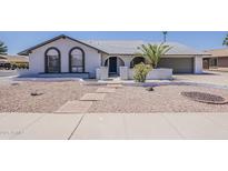 Charming single-story home with desert landscaping and a welcoming arched entryway at 2307 W Nido Ave, Mesa, AZ 85202