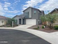 Two-story home featuring a two-car garage and a combination of stucco and siding on the facade at 2364 N 212Th Ave, Buckeye, AZ 85396