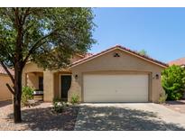 Charming single-story home with a well-maintained front yard and a two-car garage at 2893 W Five Mile Peak Rd, San Tan Valley, AZ 85144