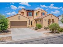 Charming two-story home with a well-maintained front yard, tile roof, and a two-car garage at 3458 E Ivanhoe St, Gilbert, AZ 85295