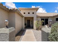 Inviting front entrance showcasing desert landscaping and stylish exterior lighting on concrete pillar feature at 3658 E Pony Track Ln, San Tan Valley, AZ 85140