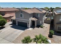 Spacious two-story home with desert landscaping and a private driveway at 4285 E Rousay Dr, San Tan Valley, AZ 85140