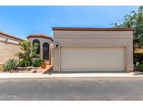 Charming single-level home with stucco exterior, a two-car garage and a decorative tiled front courtyard gate at 4313 N 29Th Way, Phoenix, AZ 85016