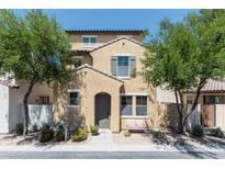 Charming two-story home featuring a welcoming front porch and well-maintained landscaping with mature trees at 451 S Hawes Rd # 53, Mesa, AZ 85208