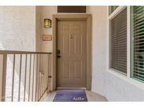 Inviting front door with stylish hardware and a welcome mat, setting a warm tone at 11375 E Sahuaro Dr # 2015, Scottsdale, AZ 85259