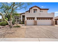 Charming two-story home showcasing a spacious three-car garage and desert landscaping at 1365 N Drexel St, Mesa, AZ 85207
