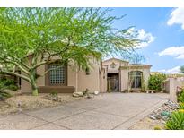 Charming home featuring desert landscaping, mature tree, and tiled roof at 15953 N 111Th Way, Scottsdale, AZ 85255